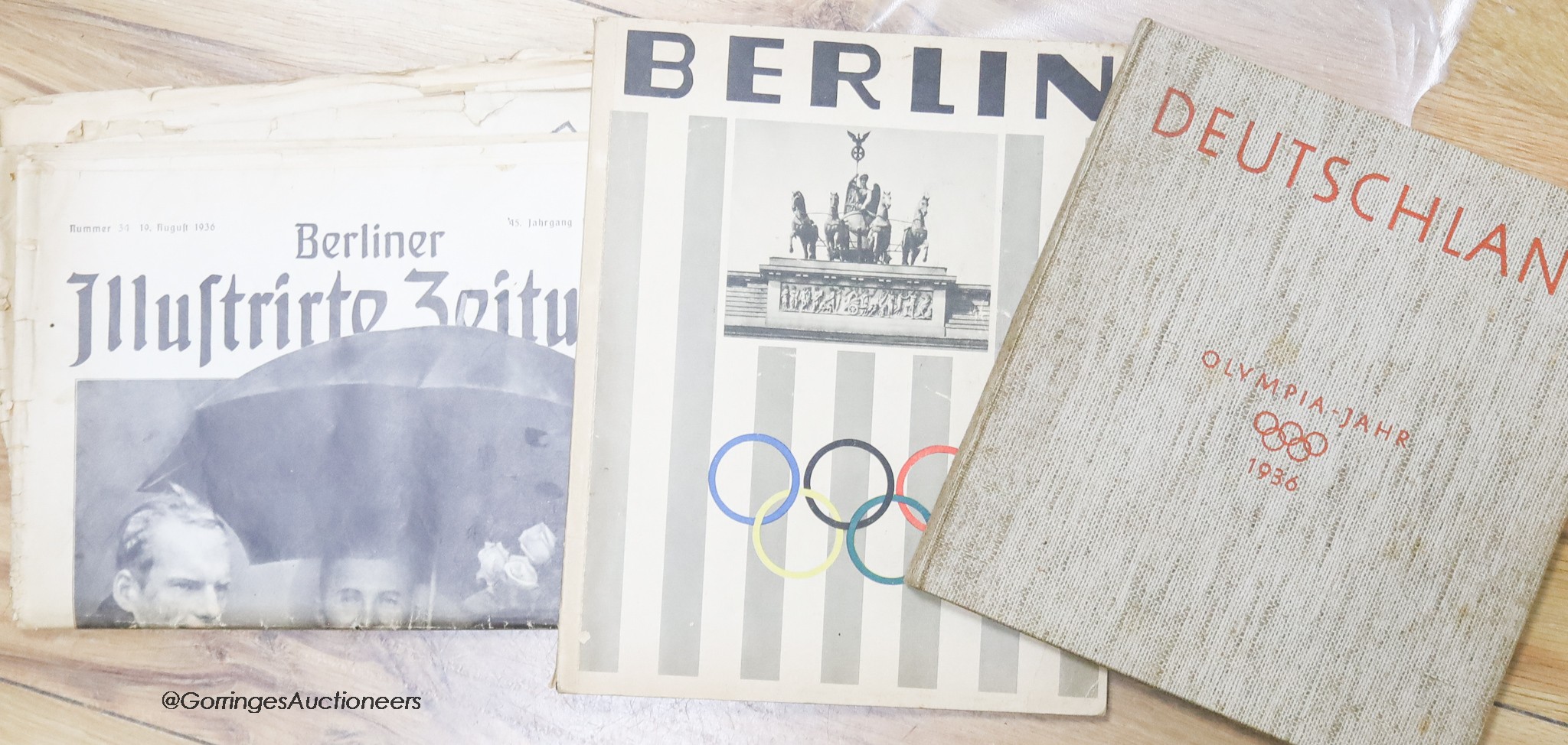 A Berlin 1936 Olympics magazine, book 1936, and a contemporary newspaper